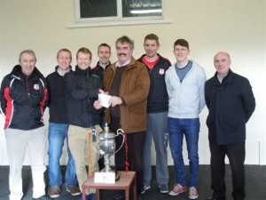 niall-sheehan-presents-the-carlow-association-london-sponsorship-cheque-to-eddie-byrne-surrounded-by-club-players-and-officials